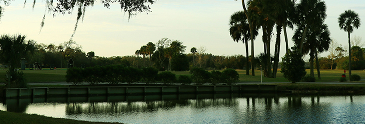 view of golf course along the water